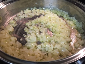 <p>Melt butter in pan, add onions and garlic. Sauté until translucent.</p>